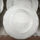 12 deep plates in porcelain with double gold trim.