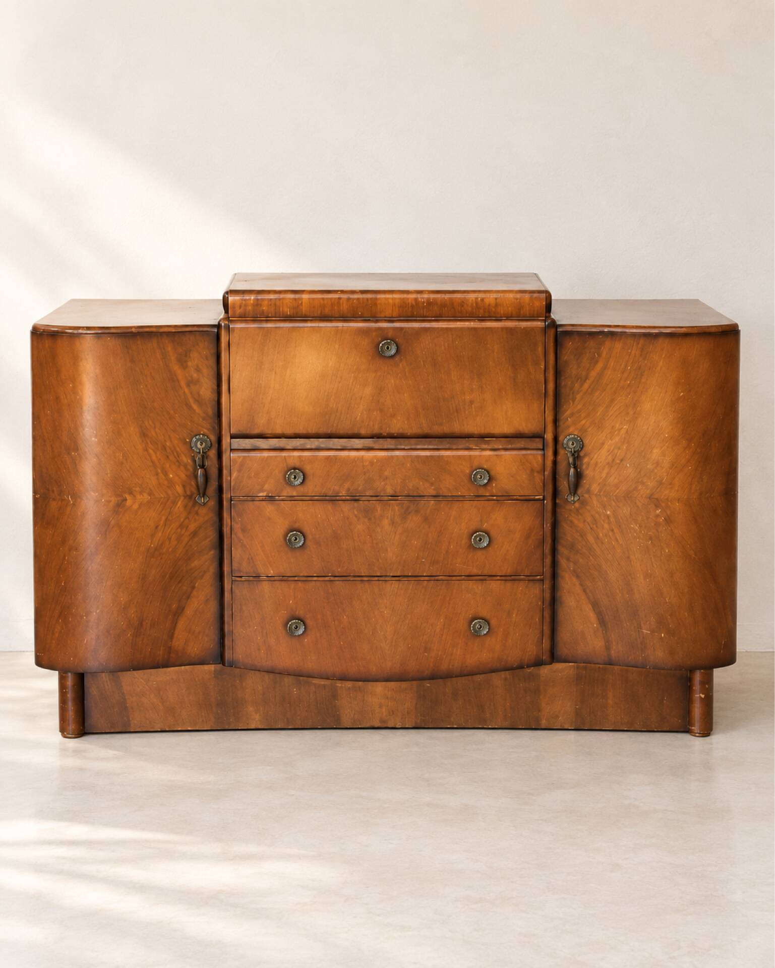 Art Deco walnut bar cabinet with a mirrored interior.