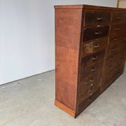 Large wooden workshop cabinet with 16 drawers, antique from the early 1900s.