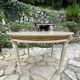 Louis XVI style round table in painted wood