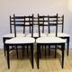 Set of 5 wooden chairs with white faux leather.