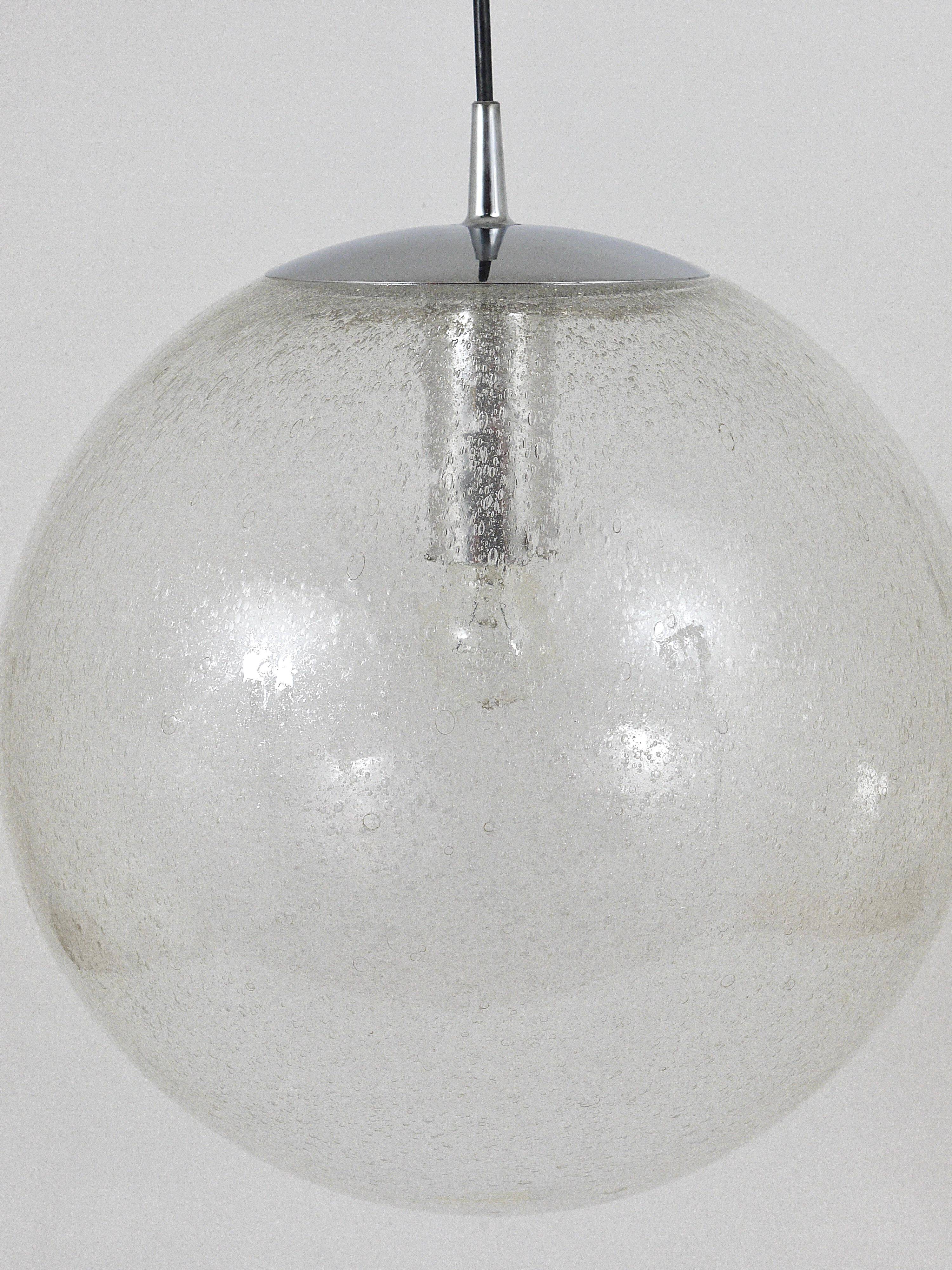 Large glass globe pendant light with bubbles and chrome by Peil & Putzler, Germany, 1970s.