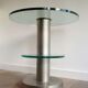 Brushed metal pedestal table and glass slabs