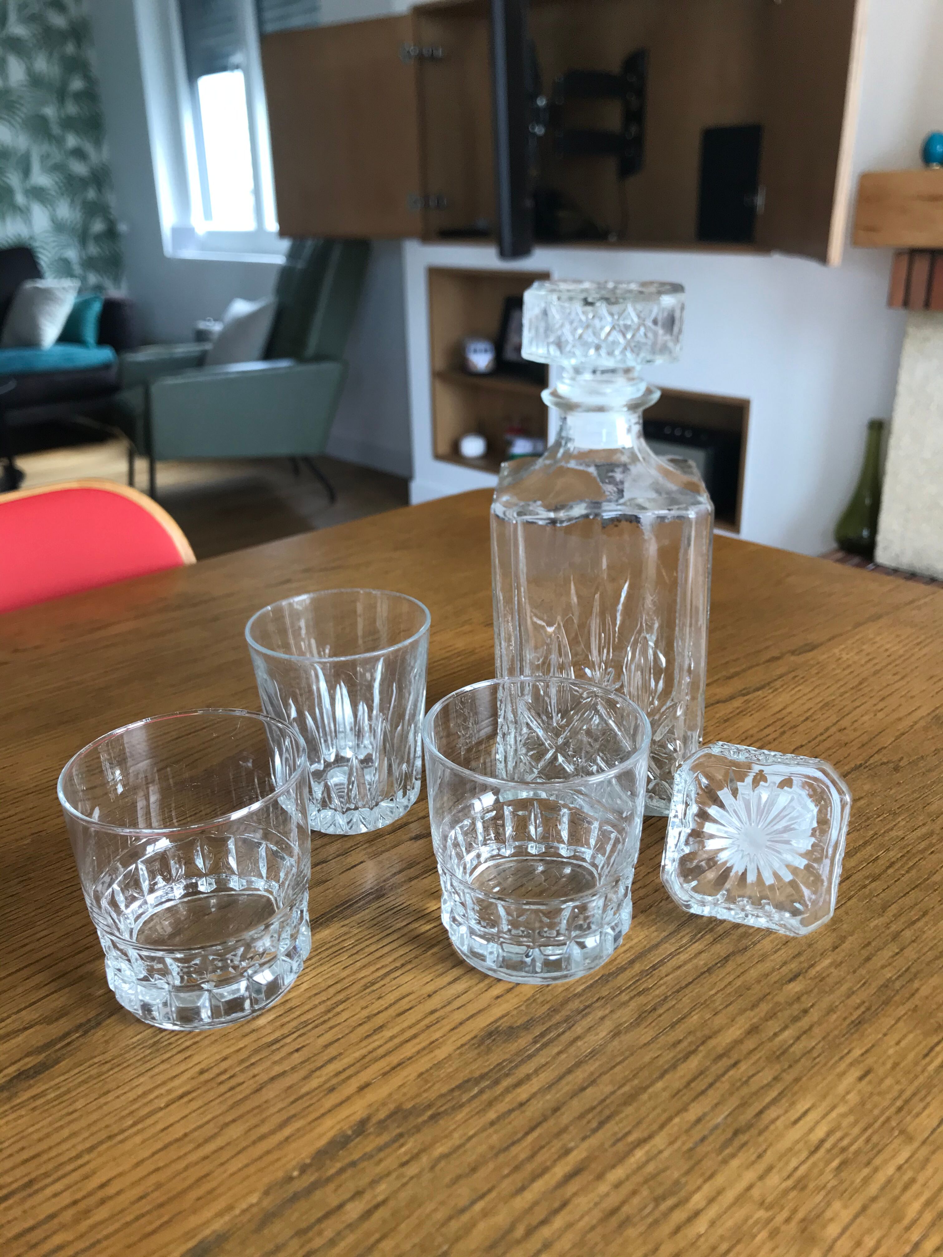 Mismatched decanter and whiskey glasses