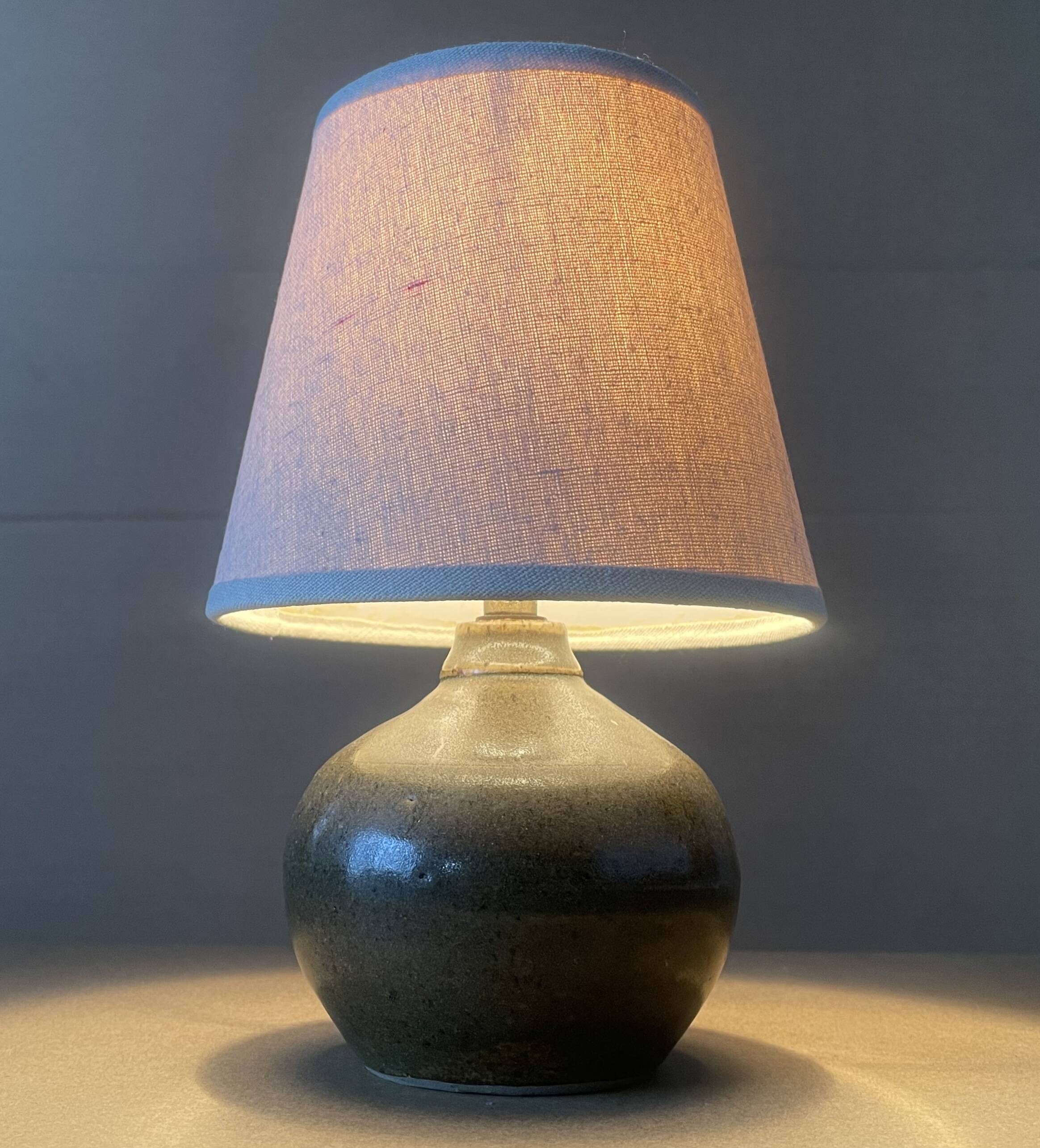 Small old enamelled sandstone lamp