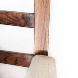 Armchair in rosewood and upholstered with light fabric, of Danish design, 1960s