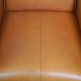 Fauteuil design artdeco en cuir de vache. grand confort et détails uniques
