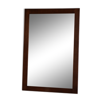 Beveled mirror grooved wood