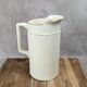 Large antique jug from Sarreguemines with golden trim.