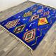 Handmade blue Moroccan rug, decorated, 250cm x 150cm