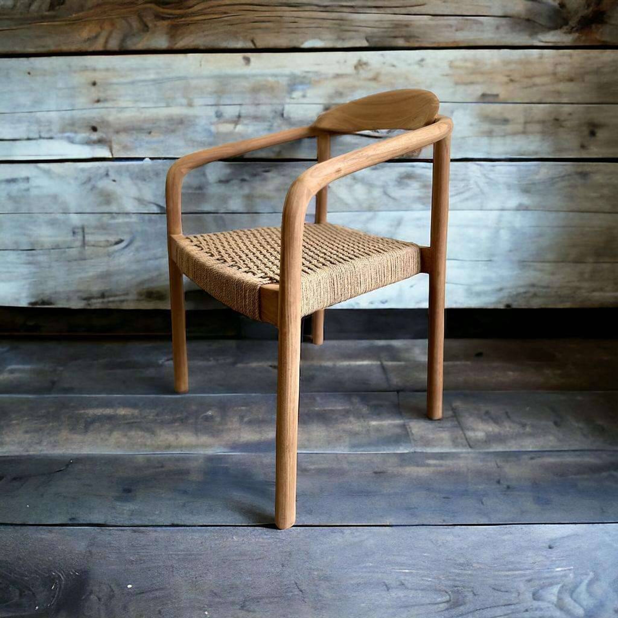 Solid wood chair with weaved seat and armrests