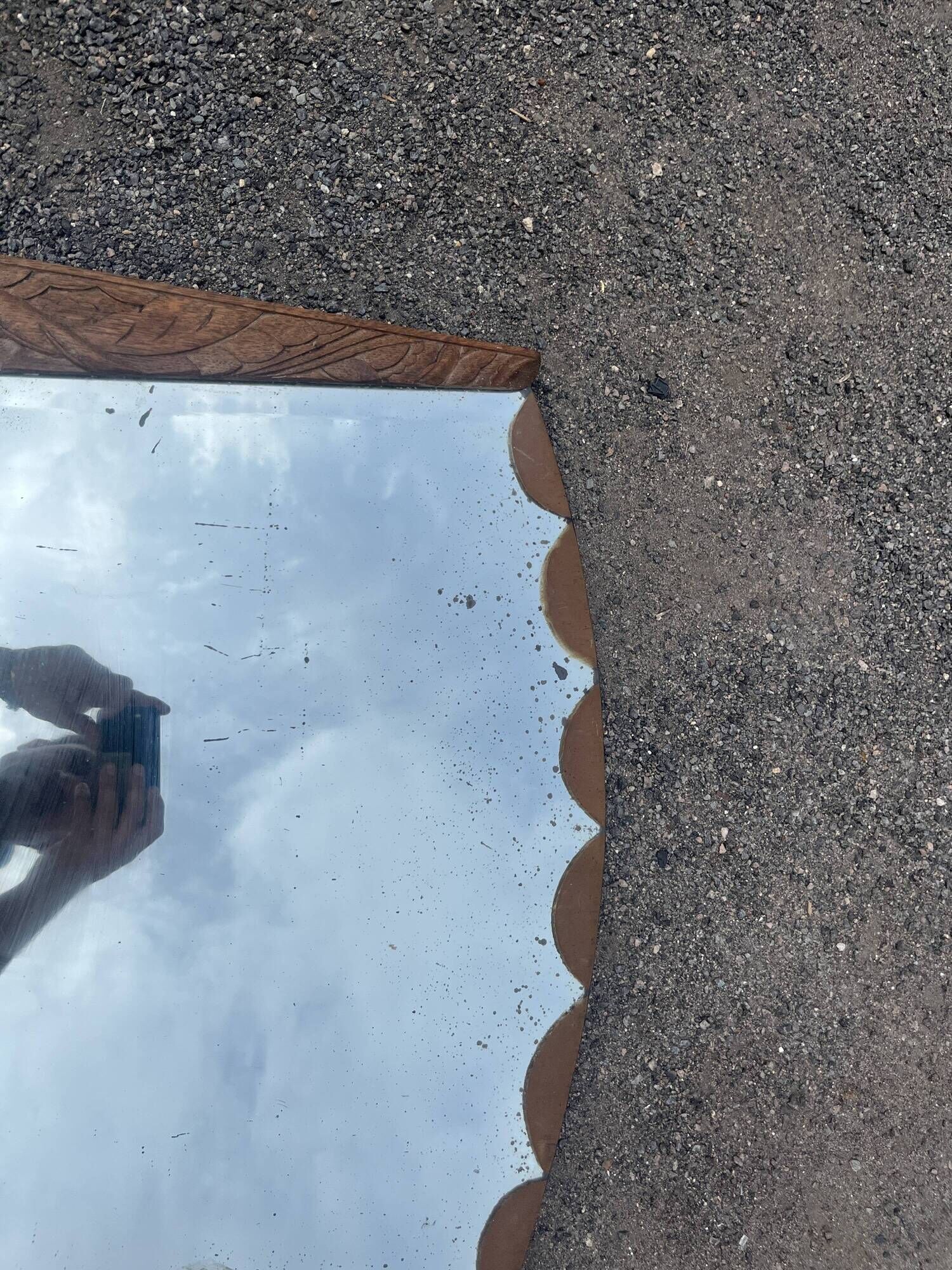 Art Deco mirror with carved wood, featuring floral motifs from the 1930s.
