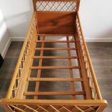 Rattan bed with compass feet