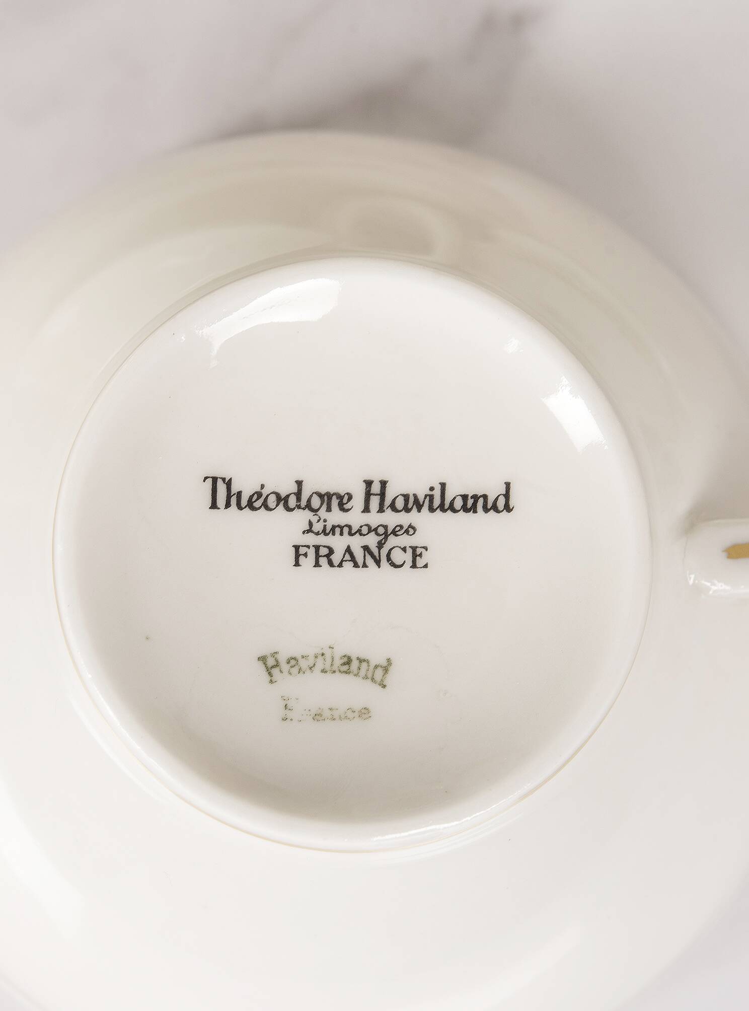 Porcelain tea service by Théodore Haviland, gilded patterns.