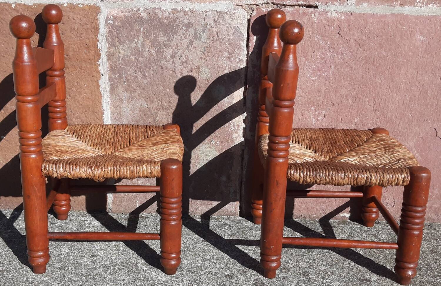 Pair of low armchairs by the fireplace. (Straw seat)