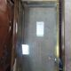 Vintage display coffee table in gilded brass and glass with a lock.