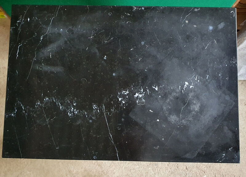 Bedside on black marble swan head