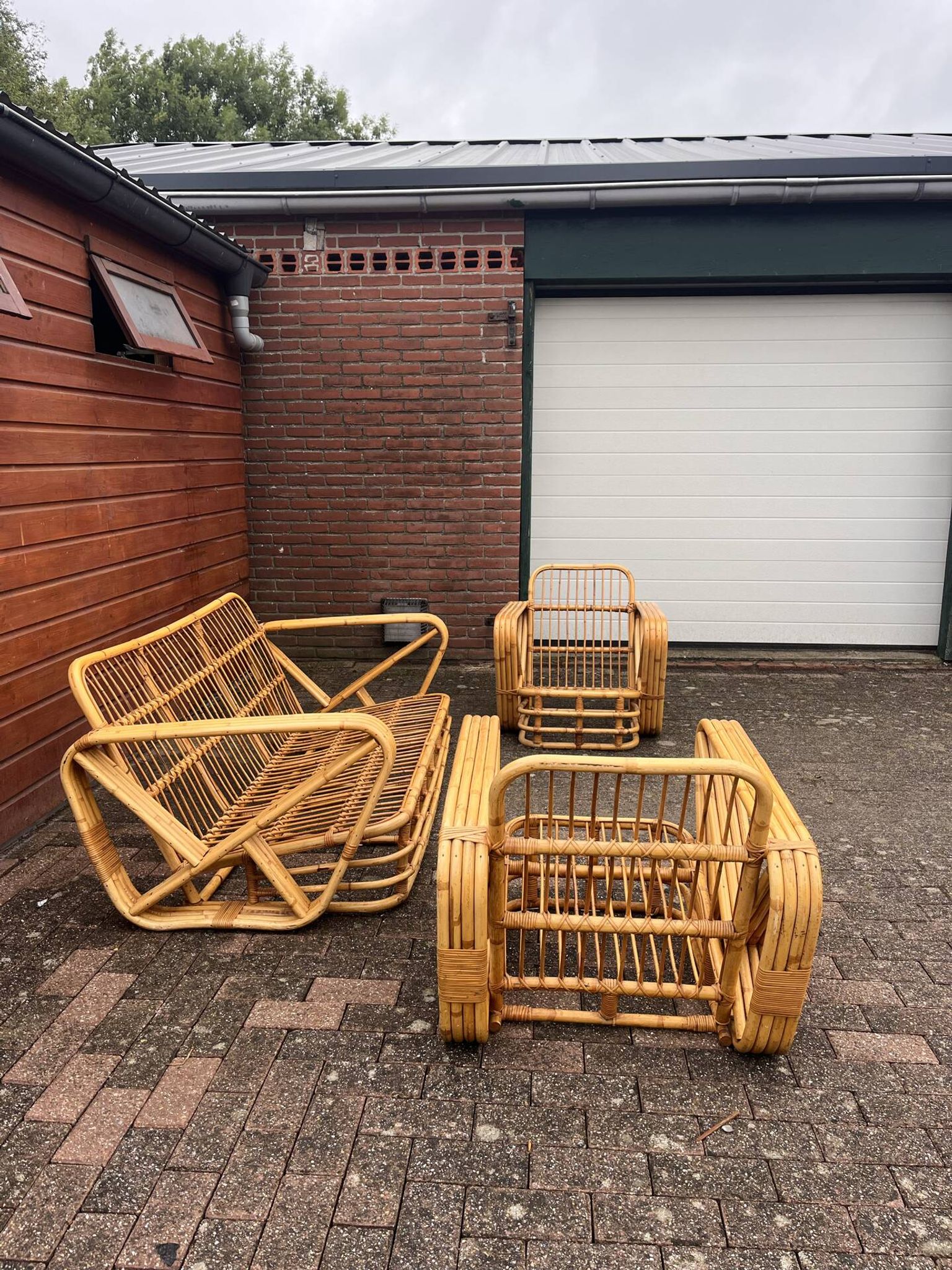 Rattan lounge | sofa + 2 armchairs | in the style of Paul Frankl |