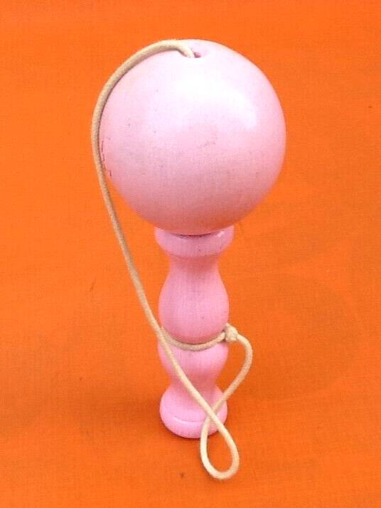 Wooden cup and ball game