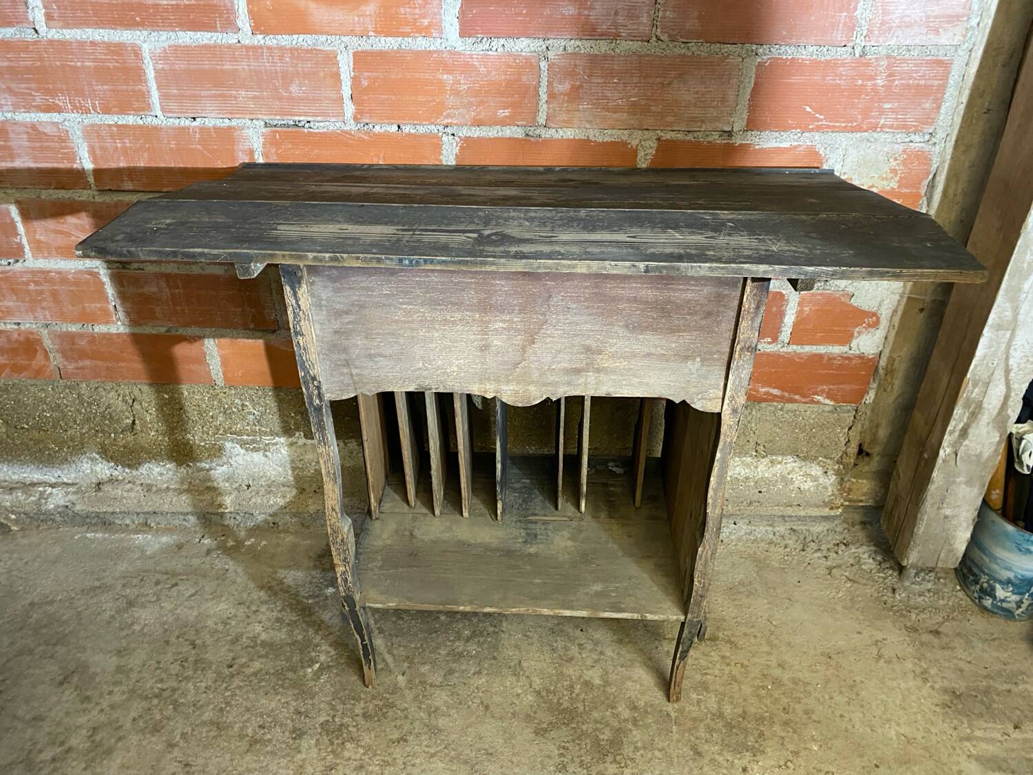 Antique writing desk, blackened wooden filing cabinet.