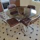 Round kitchen table with smoked glass top and 4 chairs from the 1970s.