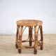 Vintage bamboo stool, woven rattan plant stand, interior decoration.