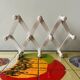 Vintage accordion coat rack in white painted wood