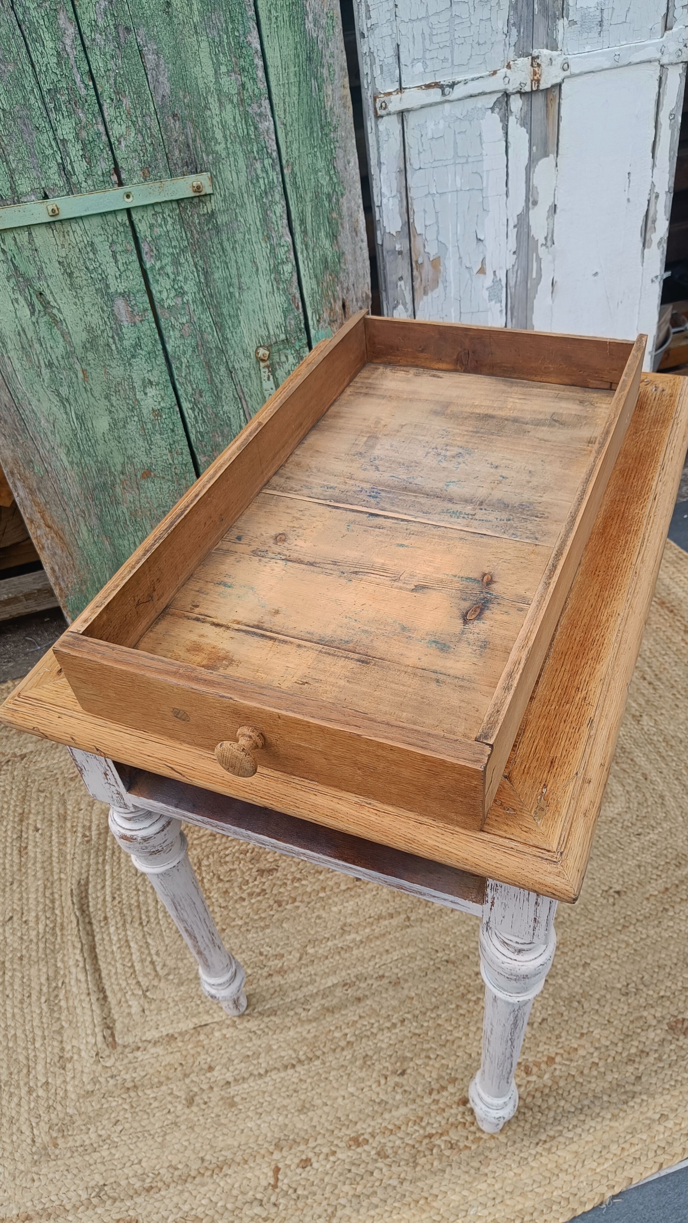 Antique drawer table with a patina.