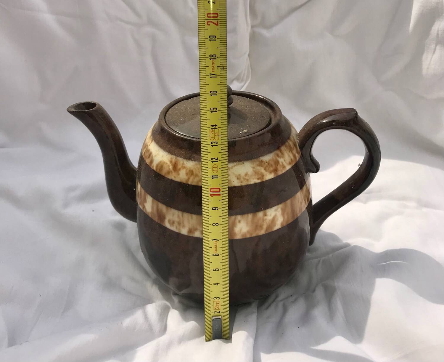 A brown England teapot