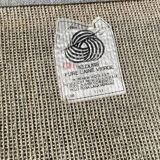 Hand-knotted wool rug by Tisca with a geometric pattern, signed "ILES", France, 1990s.