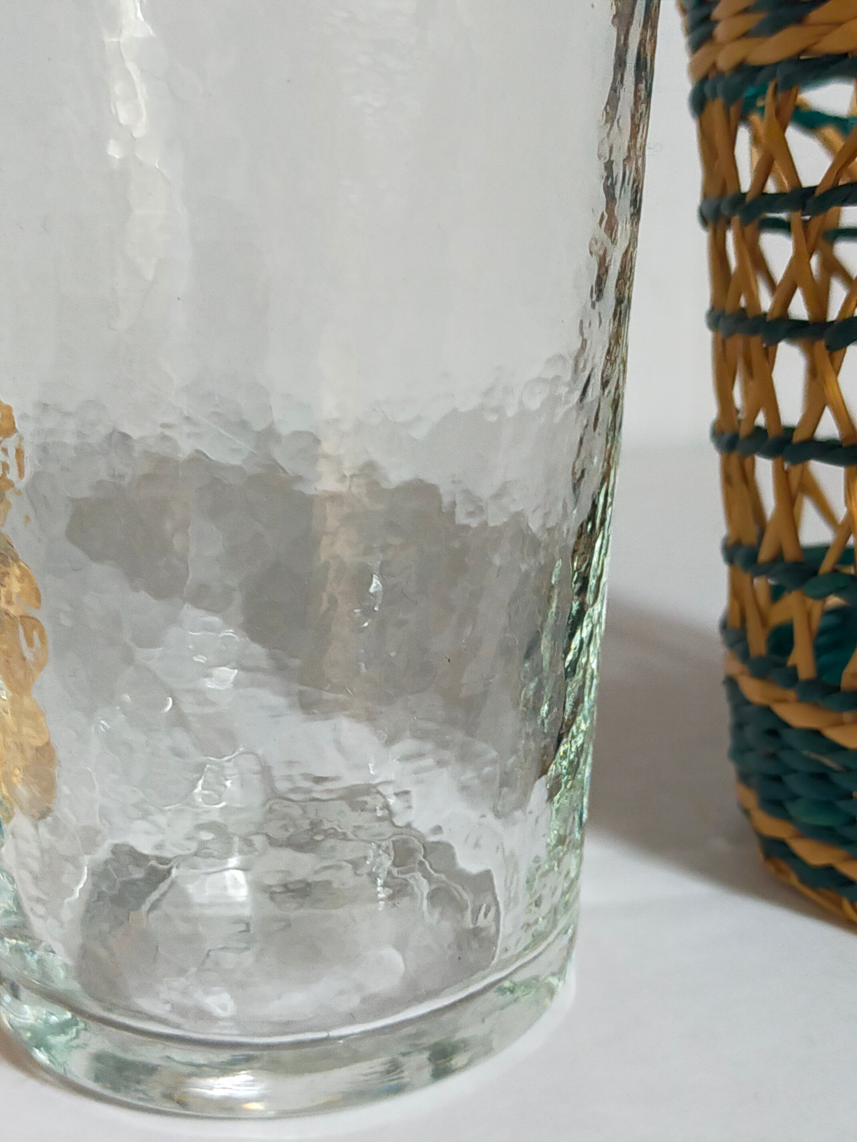 Four long drink glasses in vintage woven rattan cases