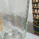 Four long drink glasses in vintage woven rattan cases