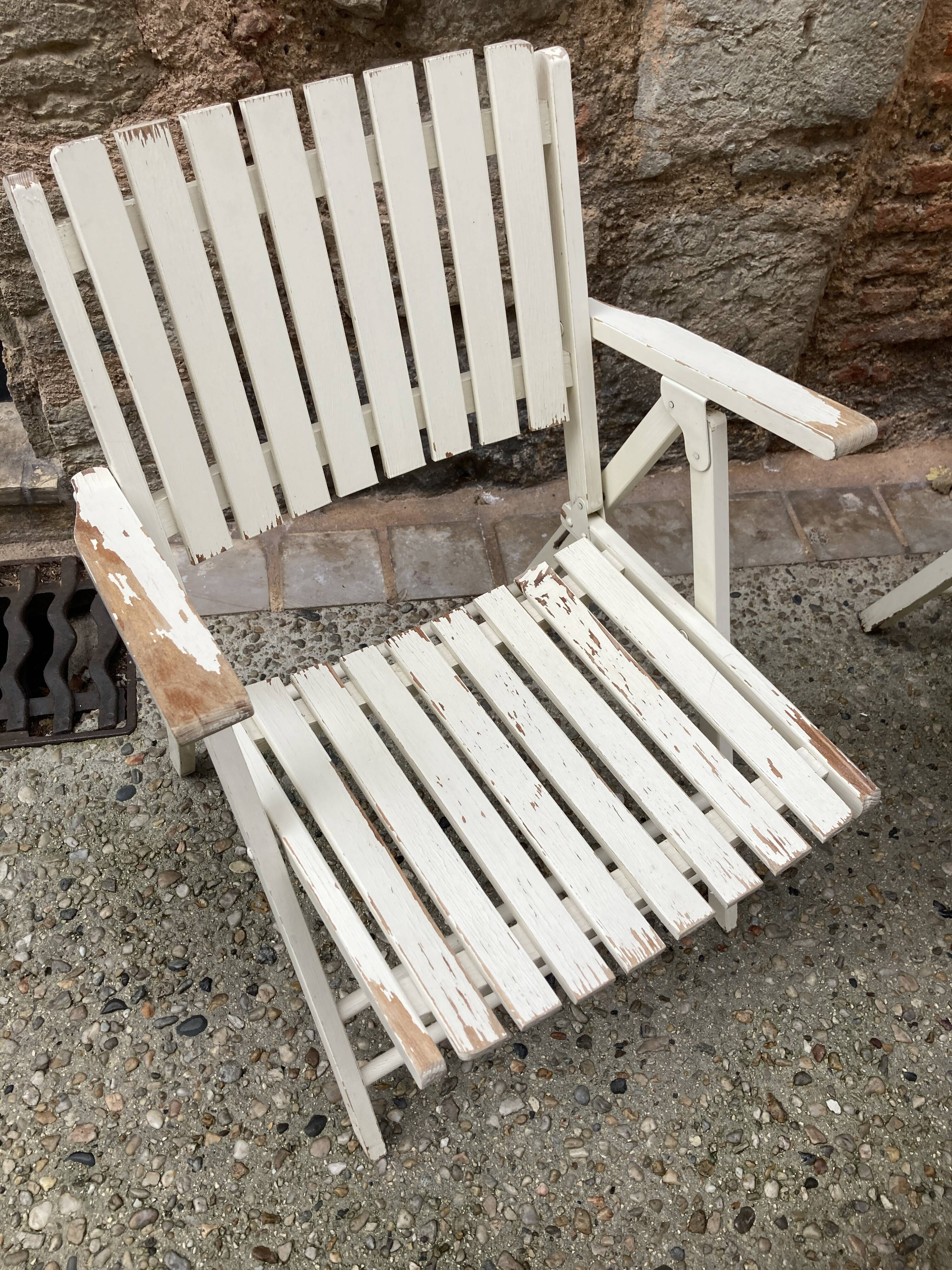 Five wooden garden armchairs