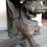 Gothic bench made of solid wood, heads of carved grotesques