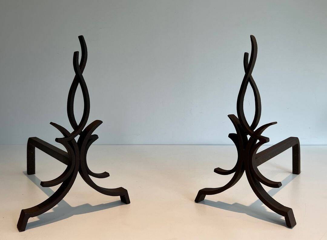 Pair of Wrought Iron Andirons with Stylised Flamboyant Uprights and Enrobed Feet