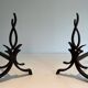 Pair of Wrought Iron Andirons with Stylised Flamboyant Uprights and Enrobed Feet
