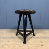 Unmarked black Rowac stool with a dark wood seat.
