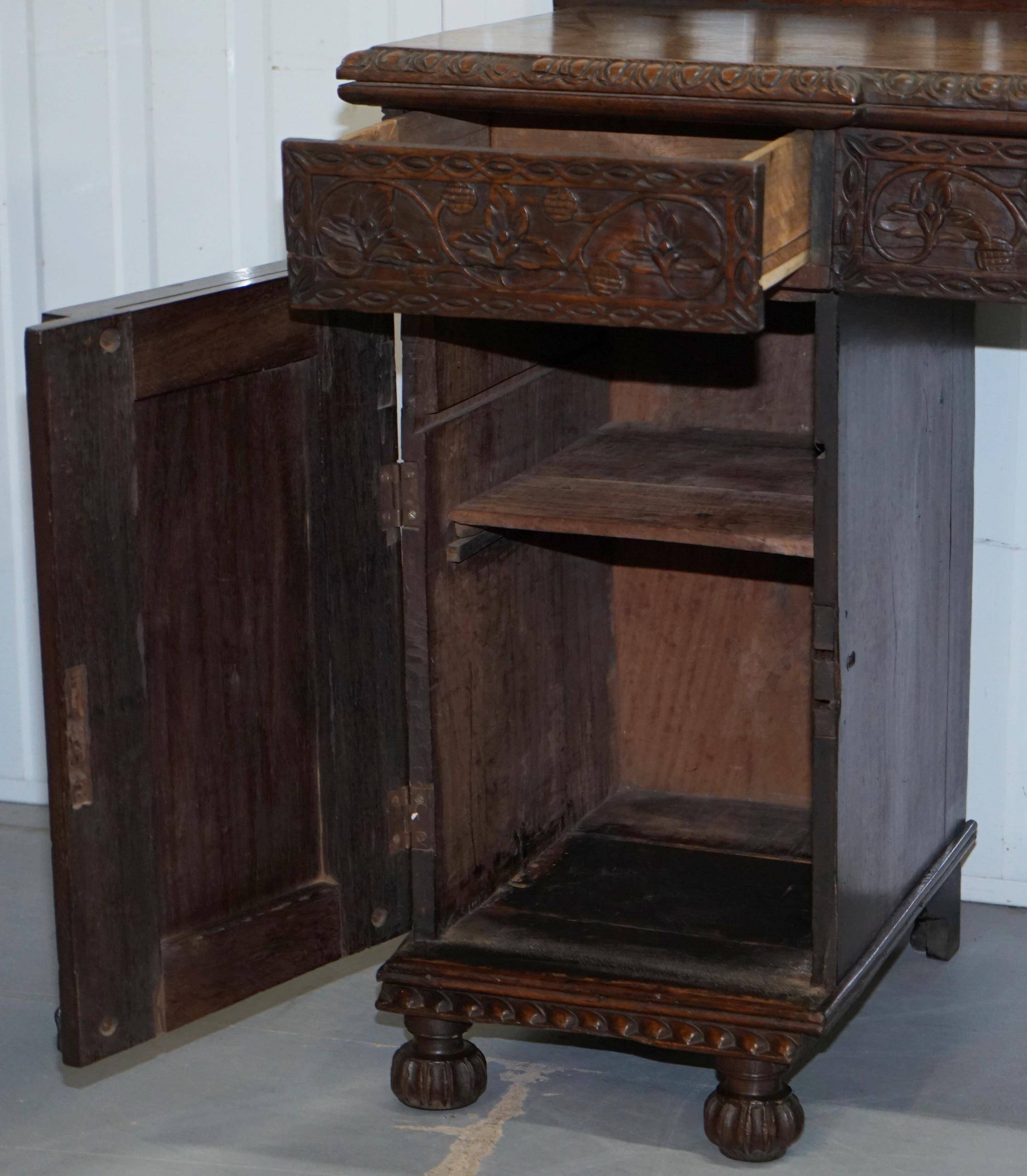 19th-century hand-carved Anglo-Burmese buffet with drawers and cupboards.