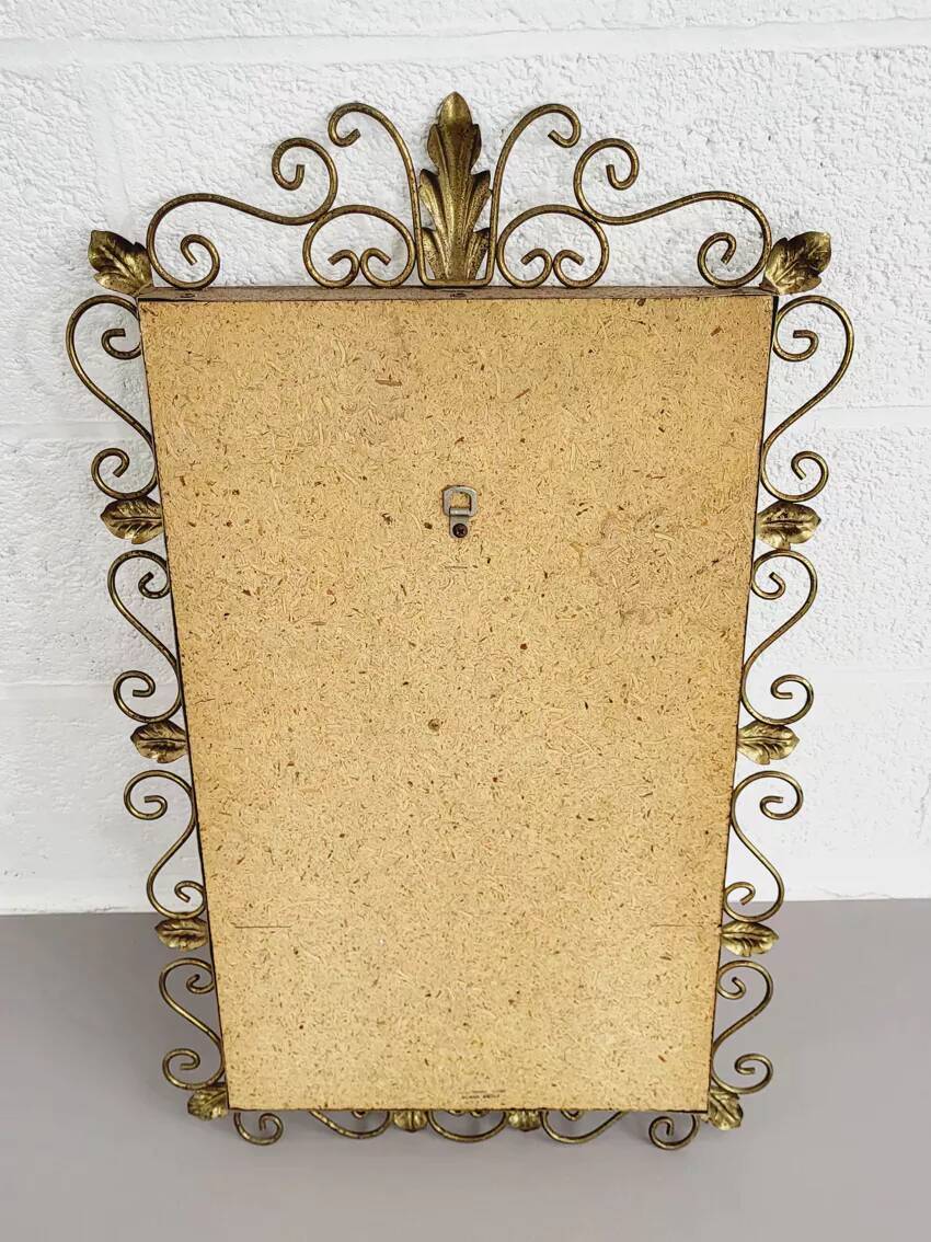 Rectangular mirror from the 1950s with a brass frame.
