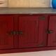 Low red "Guérande" buffet, zinc top, butcher's fridge-style doors