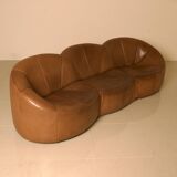 "Pumpkin" 3-seater canapé in patinated brown leather by Pierre Paulin for Arti.
