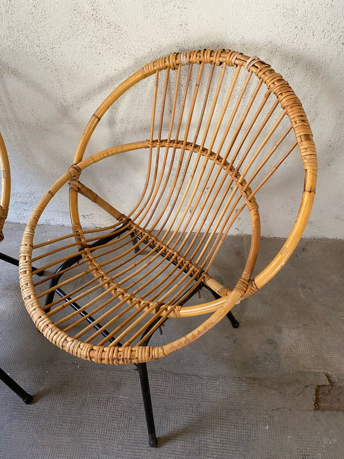 Two rattan armchairs