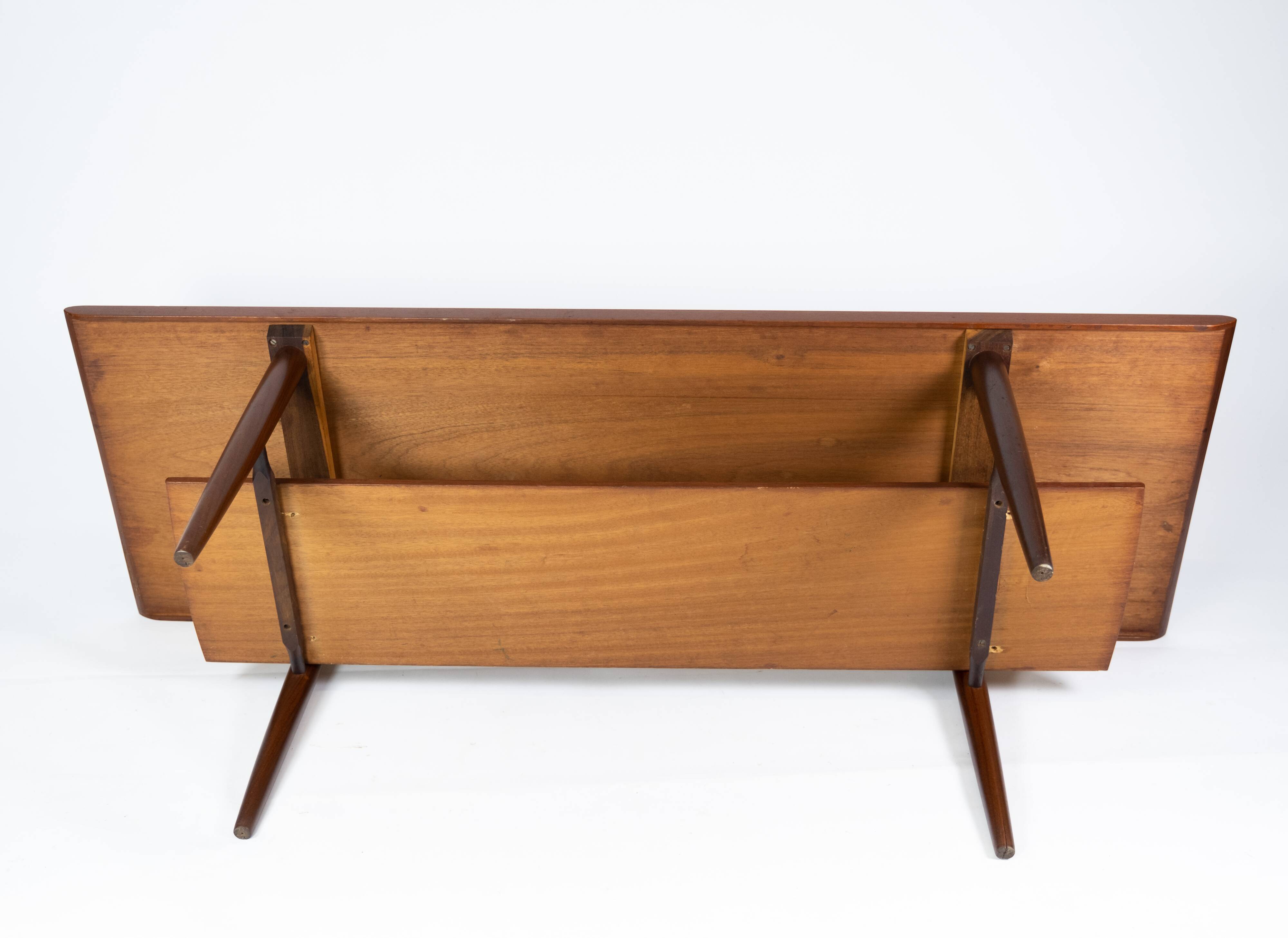 Coffee table in teak with blue tiles of danish design from the 1960s.