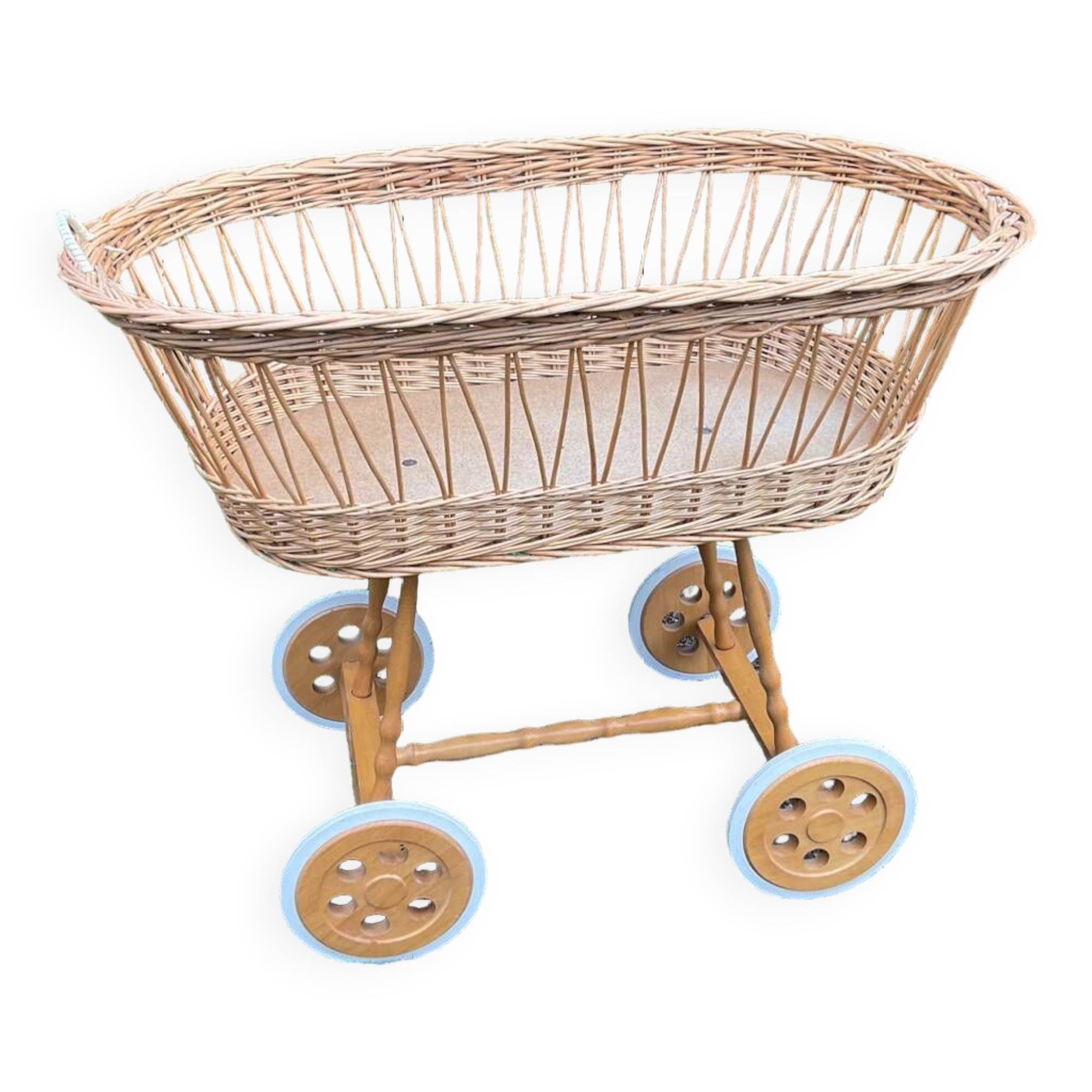 Vintage wicker cradle on casters