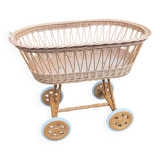 Vintage wicker cradle on casters