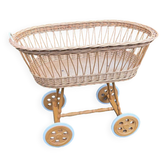 Vintage wicker cradle on casters