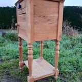 Raw wood bedside table