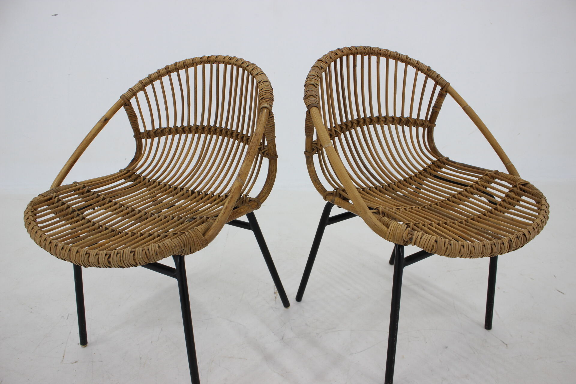 1970s pair of Alan Fuchs rattan and iron lounge chairs, Czechoslovakia