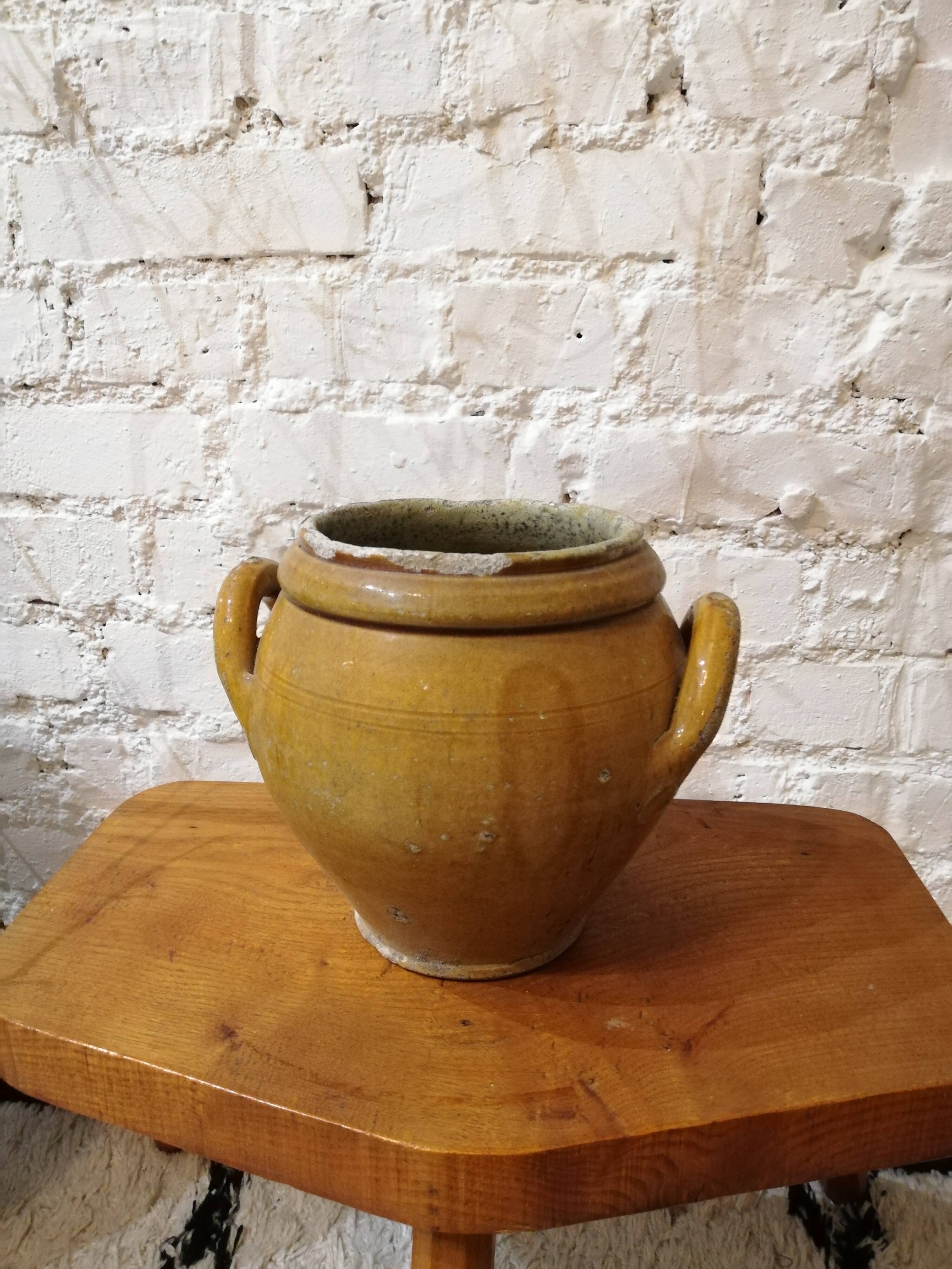 Old yellow glazed terracotta pot