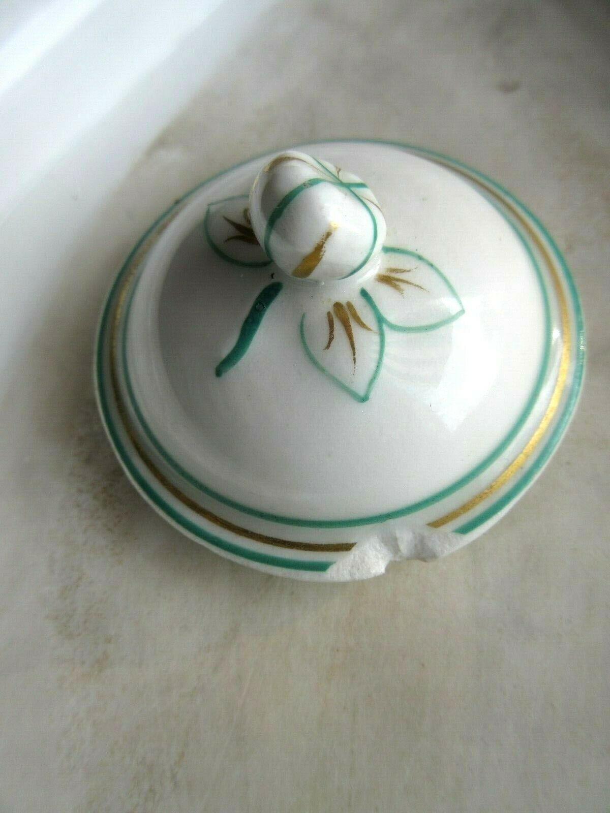 Porcelain cream service of Paris 1850, 6 pots on green and gold oval tray